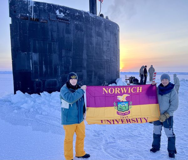 CDR Michael Brown '03; ENS Moran Qiu '22
